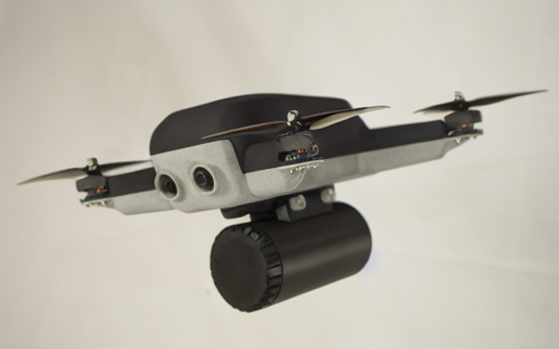 Gray and black quadcopter drone with a cylindrical camera or sensor module beneath the airframe