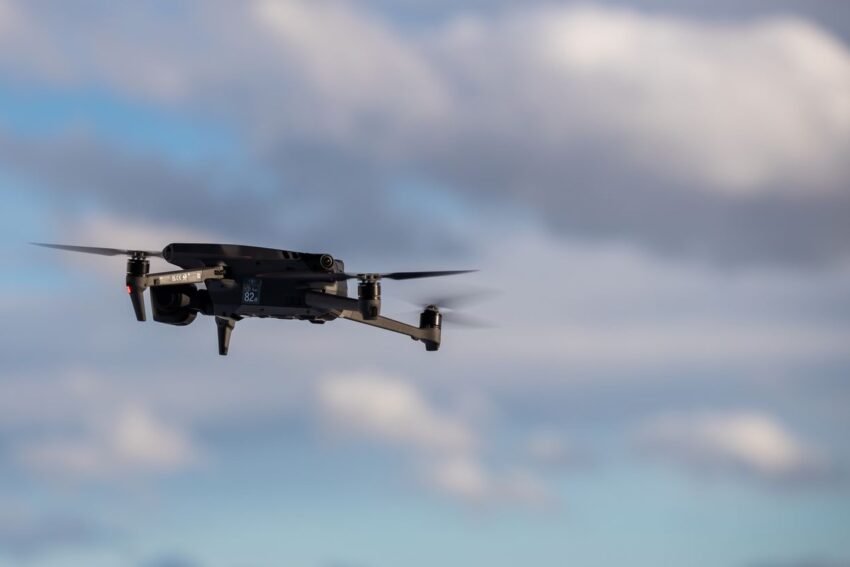 A drone flying over snowy mountains.