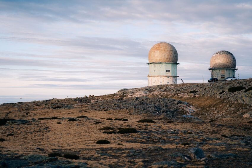 Radar domes on a rocky landscape